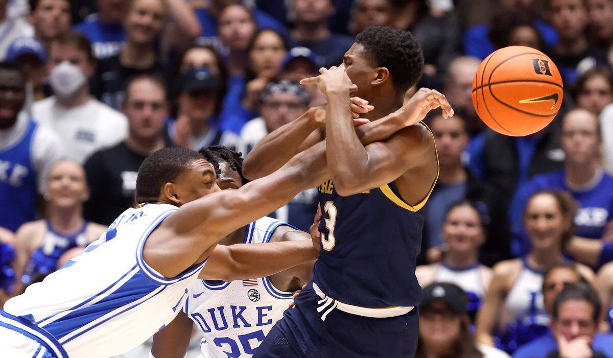 Duke’s Jaylen Blakes (2) knocks the ball from Notre Dame’s Markus Burton (3) during the second half of Duke’s 71-53 victory over Notre Dame at Cameron Indoor Stadium in Durham, N.C., Wednesday, Feb. 7, 2024.