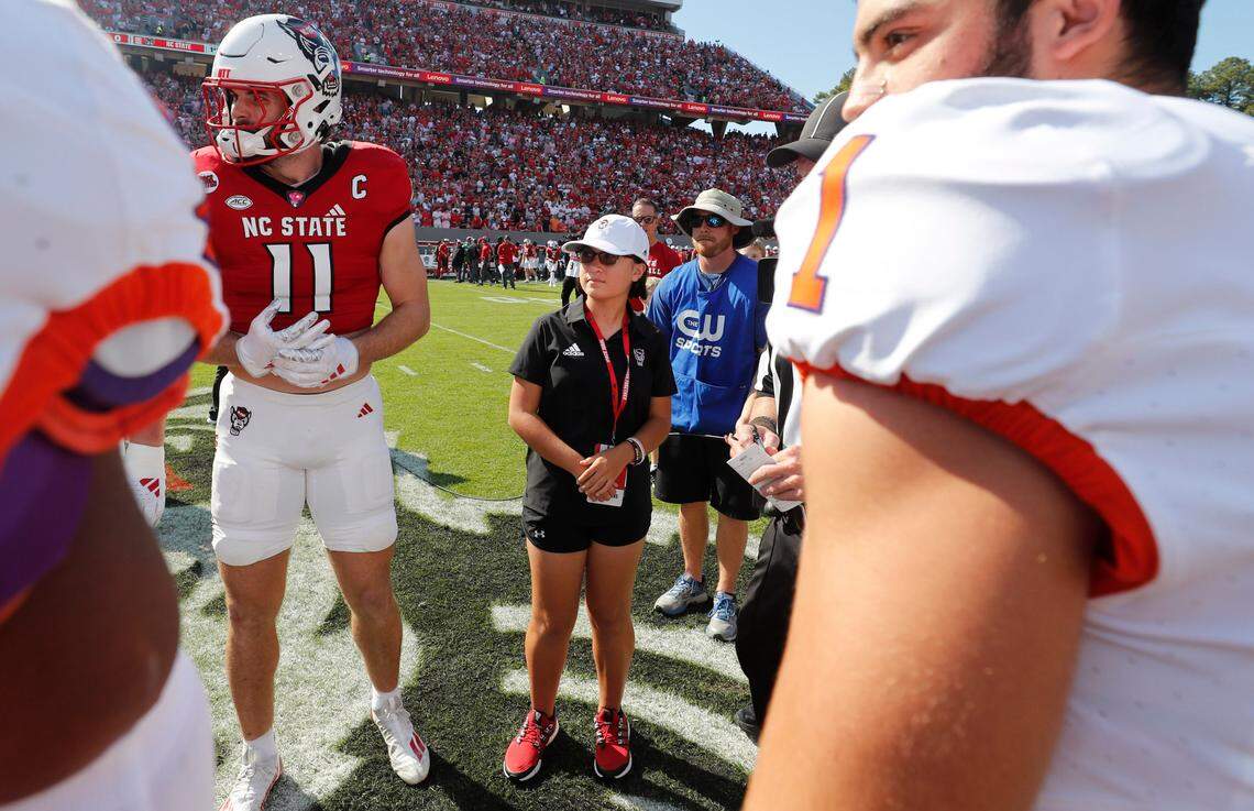 Payton Gibbs walked with the captains to watch the coin toss with before N.C. State’s game against Clemson at Carter-Finley Stadium in Raleigh, N.C., Saturday, Oct. 28, 2023.