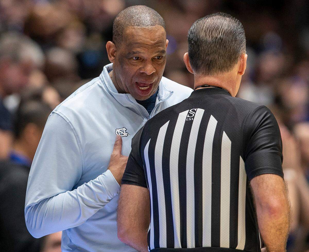 North Carolina coach Hubert Davis has a word with official Roger Ayers in the second half against Duke on Saturday, February 4, 2023 at Cameron Indoor Stadium in Durham, N.C.