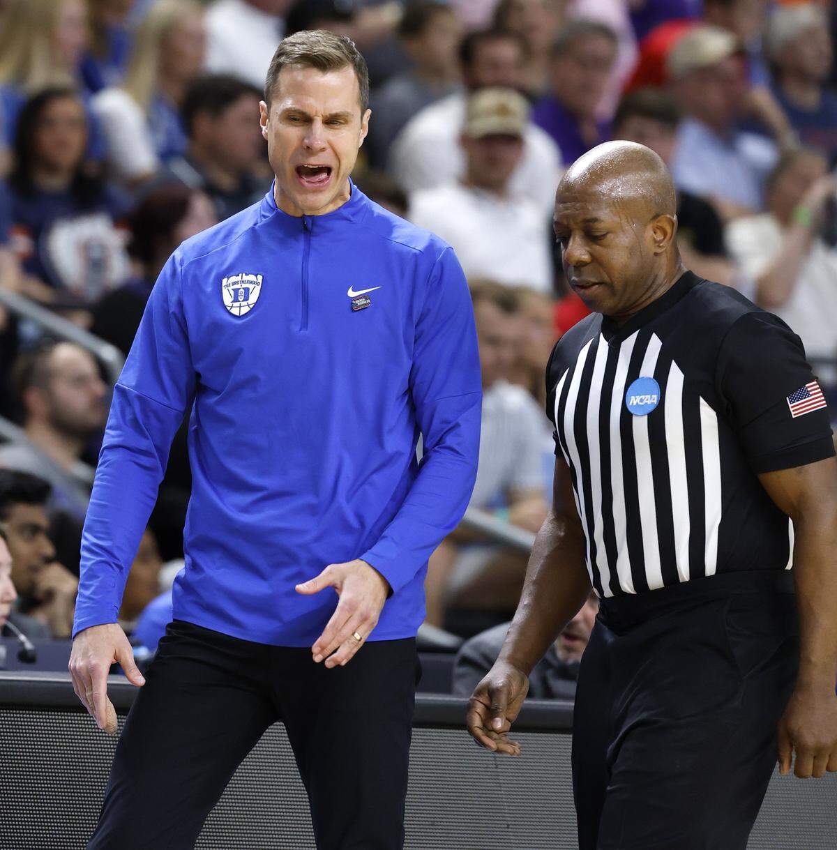 Duke’s Jon Scheyer has words with an official during the first half of Duke’s game against TCU in the second round of the NCAA Men’s Basketball Tournament at  Bon Secours Wellness Arena in Greenville, S.C., Saturday, March 21, 2026.