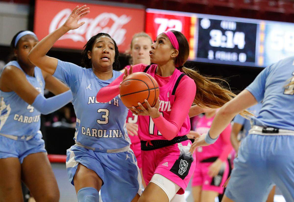 N.C. State’s Jakia Brown-Turner (11) drives to the basket past North Carolina’s Kennedy Todd-Williams (3) during the second half of N.C. State’s 82-63 victory over UNC in the annual Play4Kay game at Reynolds Coliseum in Raleigh, N.C., Sunday, February 21, 2021.