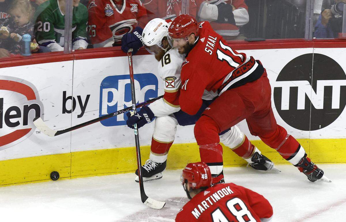 Carolina center Jordan Staal (11) works against Florida defenseman Marc Staal (18) during the first period of the Hurricanes’ game against the Panthers in the first game of Eastern Conference Finals at PNC Arena in Raleigh, N.C., on Thursday, May 18, 2023.