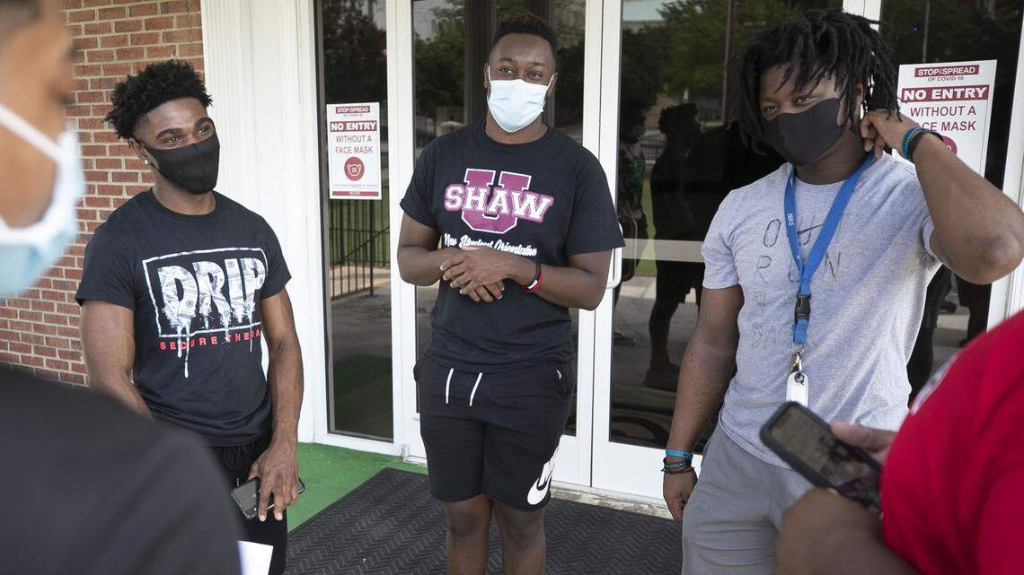 Shaw University freshmen Deron Orr, from Wisconsin, Greg Pinkney from Georgia and Desmond Johnson from Florida, gather for orientation at Boyd Chapel on Tuesday, August 11, 2020 in Raleigh, N.C. Shaw will begin classes on August 12 amid the COVID-19 pandemic, with only about 50 percent of their student population on campus.