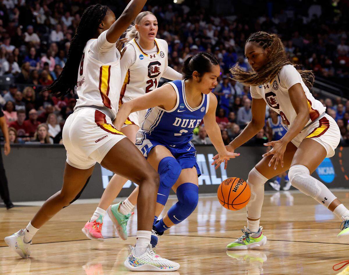 Duke’s Vanessa de Jesus is swarmed by South Carolina’s Joyce Edwards, Chloe Kitts and Bree Hall during the first half of the Blue Devils’ 54-50 loss in the NCAA Tournament Elite Eight at Legacy Arena on Sunday, March 30, 2025, in Birmingham, Ala.