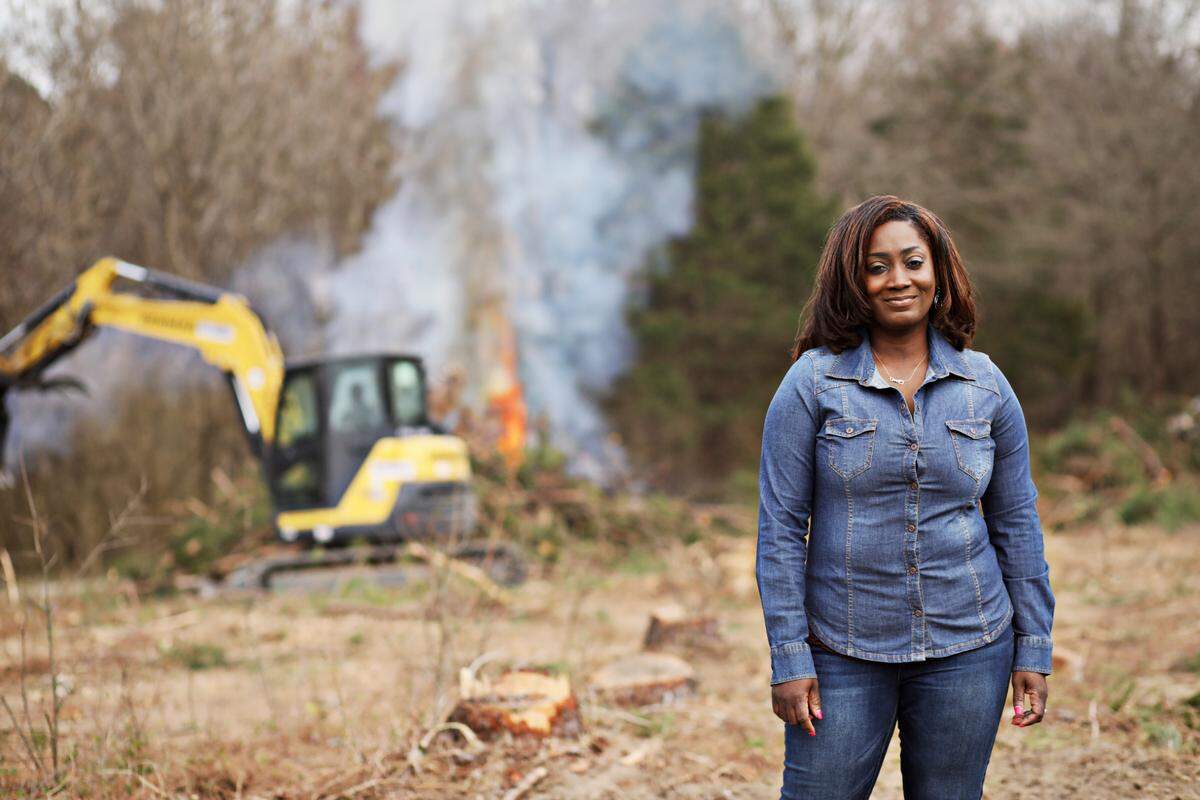 Latonya Andrews stands in a newly cleared field Friday, March 12, 2021, in Norlina, NC, that will be returned to farming. Andrews is the 4th generation of her family to farm these 60 acres, starting with her great-grandmother, who bought it in the 1940s. Congress is considering providing $5 billion in aid to disadvantaged farmers (including debt relief) in the federal relief bill.