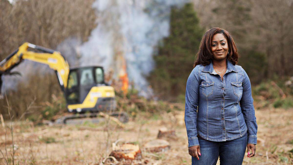 Latonya Andrews stands in a newly cleared field Friday, March 12, 2021, in Norlina, NC, that will be returned to farming. Andrews is the 4th generation of her family to farm these 60 acres, starting with her great-grandmother, who bought it in the 1940s. Congress is considering providing $5 billion in aid to disadvantaged farmers (including debt relief) in the federal relief bill.