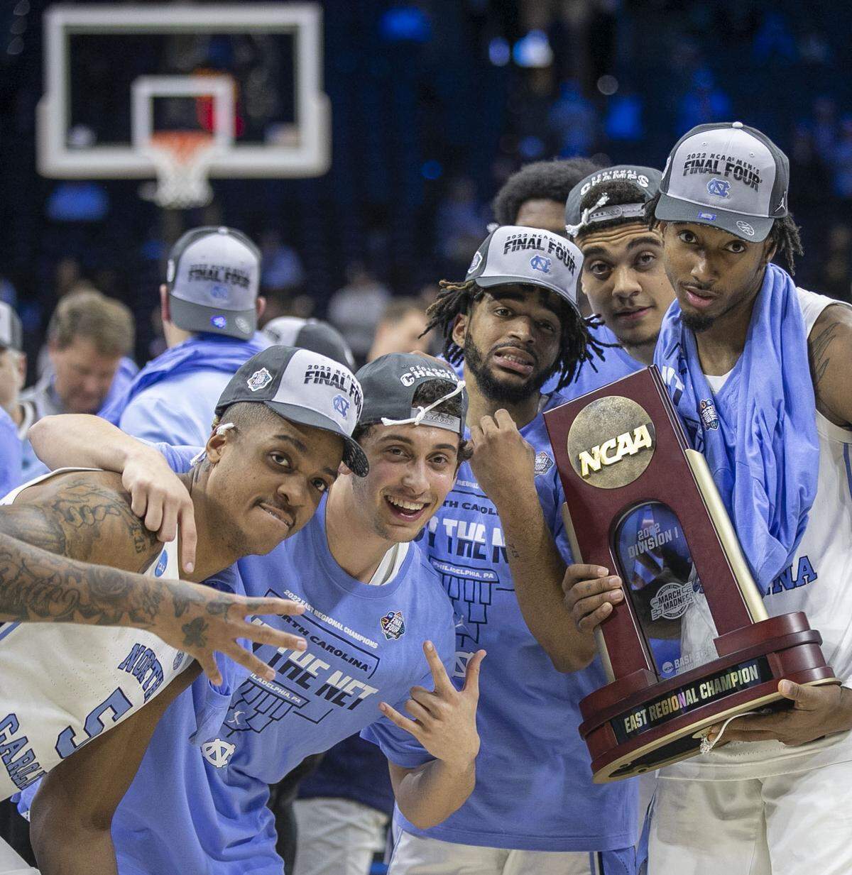 North Carolina’s Armando Bacot (5), Creighton Lebo (25), R.J. Davis (4), Justin McKoy (22) and Leaky Black (1) pose with the NCAA East Regional Championship trophy following the Tar Heels’ 69-49 victory over Saint Peter’s in the NCAA East Regional Championship game on Sunday, March 27, 2022 at Wells Fargo Center in Philadelphia, Pa.