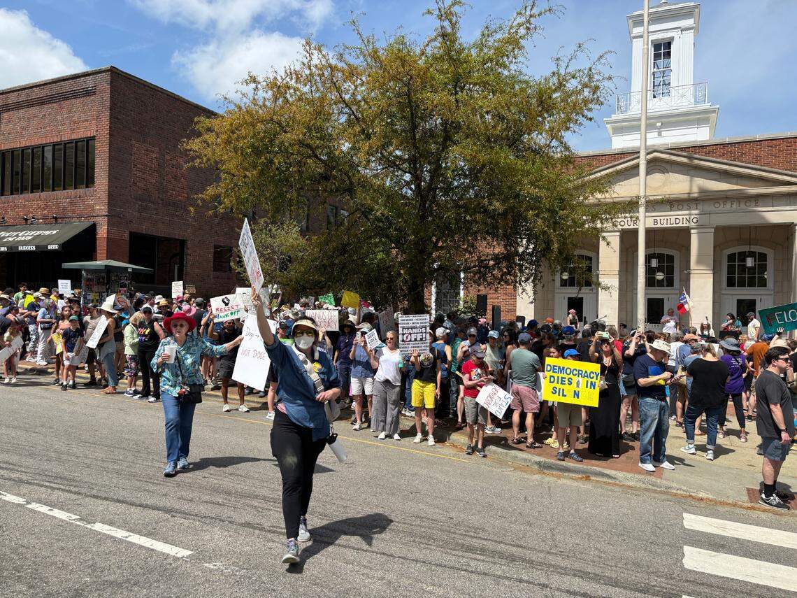Hundreds of people gathered on East Franklin Street between McCorkle Place and Peace and Justice Plaza in Chapel Hill on Saturday as part of the nationwide set of “HandsOff” protests.
