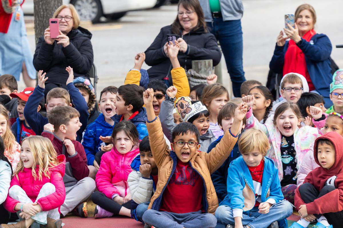 School children cheer after an armadillo named ‘Silvia’ predicted an early spring according to Apex Mayor Jacques Gilbert on Groundhog Day, Feb. 2, 2024 at Olive Chapel Elementary School in Apex.