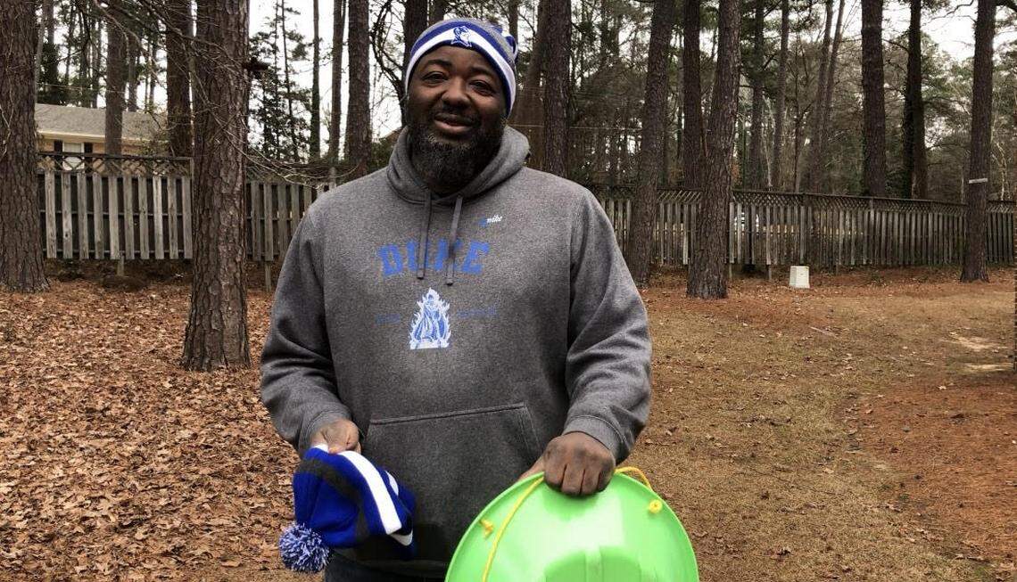 Darrick Wilson of Sanford wore a Duke Blue Devils toboggan Friday, Jan. 10, while doing chores before the arrival of a winter storm headed for central North Carolina.