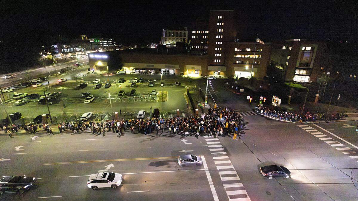 About 200 demonstrators held a candlelight vigil Wednesday, Jan. 28, 2026, outside the Durham VA Medical Center to honor Alex Pretti, a 37-year-old Minneapolis intensive care nurse with the Department of Veterans Affairs. Pretti was shot and killed Jan. 24, 2026, during a federal immigration enforcement operation in Minneapolis, an incident that has sparked widespread protests and calls for investigation.