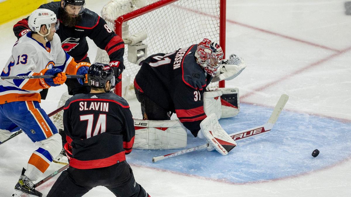 Carolina Hurricanes goalie Frederik Andersen (31) deflects a scoring attempt by New York Islanders center Matthew Barzal (13) in the second period during Game 5 of the NHL Eastern Conference quarterfinals agains the New York Islanders on Tuesday, April 30, 2024 at PNC Arena, in Raleigh N.C.