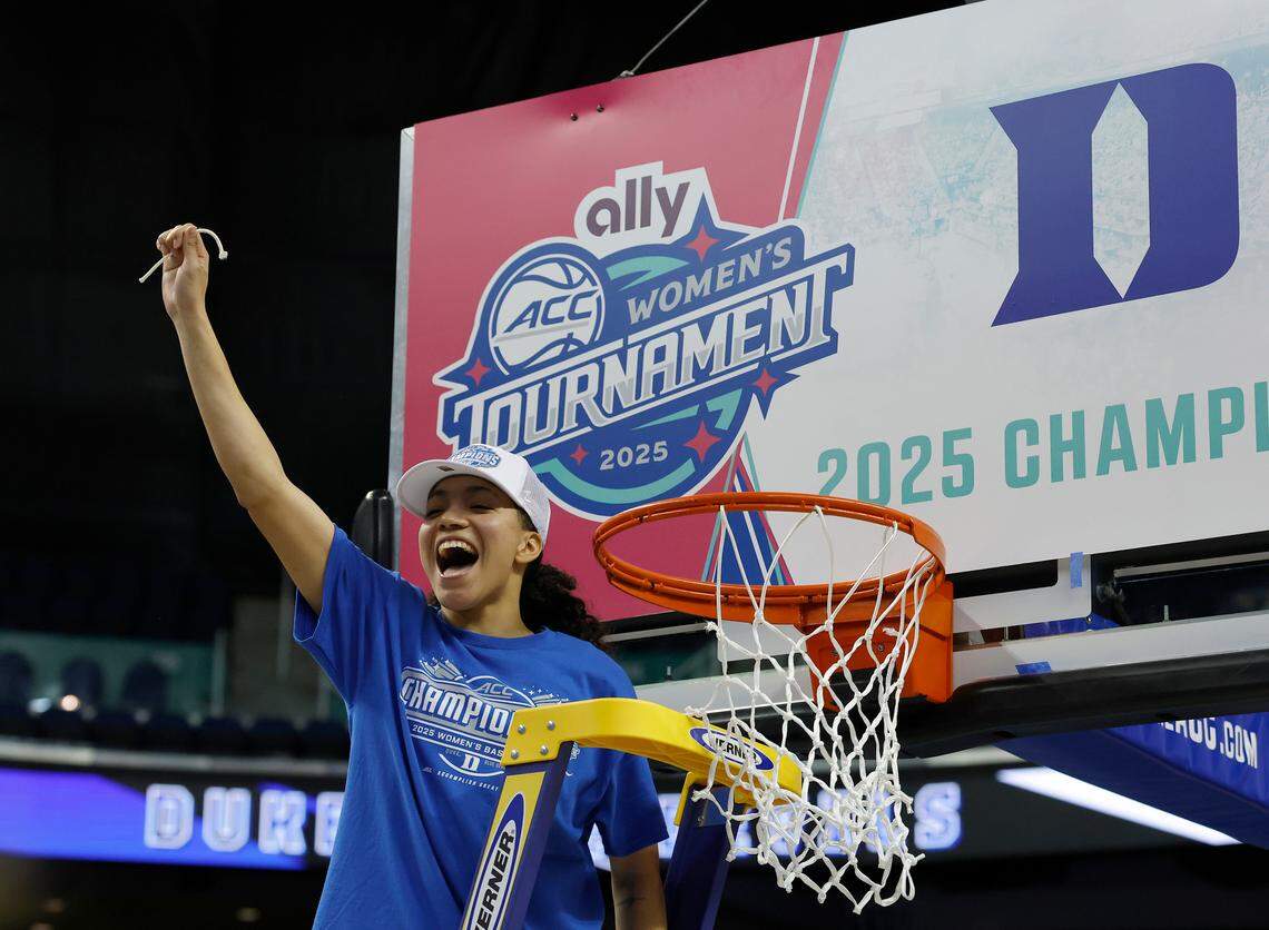 Duke’s Taina Mair smiles after cutting a piece of the net following the Blue Devils’ 76-62 win over N.C. State in the ACC Tournament final on Sunday, March 9, 2025, at First Horizon Coliseum in Greensboro, N.C.