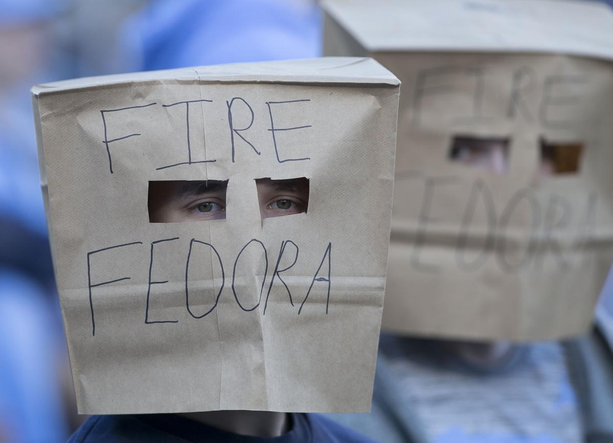 North Carolina students, who wanted to remain anonymous, covered their heads with paper bags to show their displeasure with football coach Larry Fedora, calling for him to be fired, during the Tar Heels’ game against Western Carolina on Saturday, November 17, 2018 at Kenan Stadium in Chapel Hill.