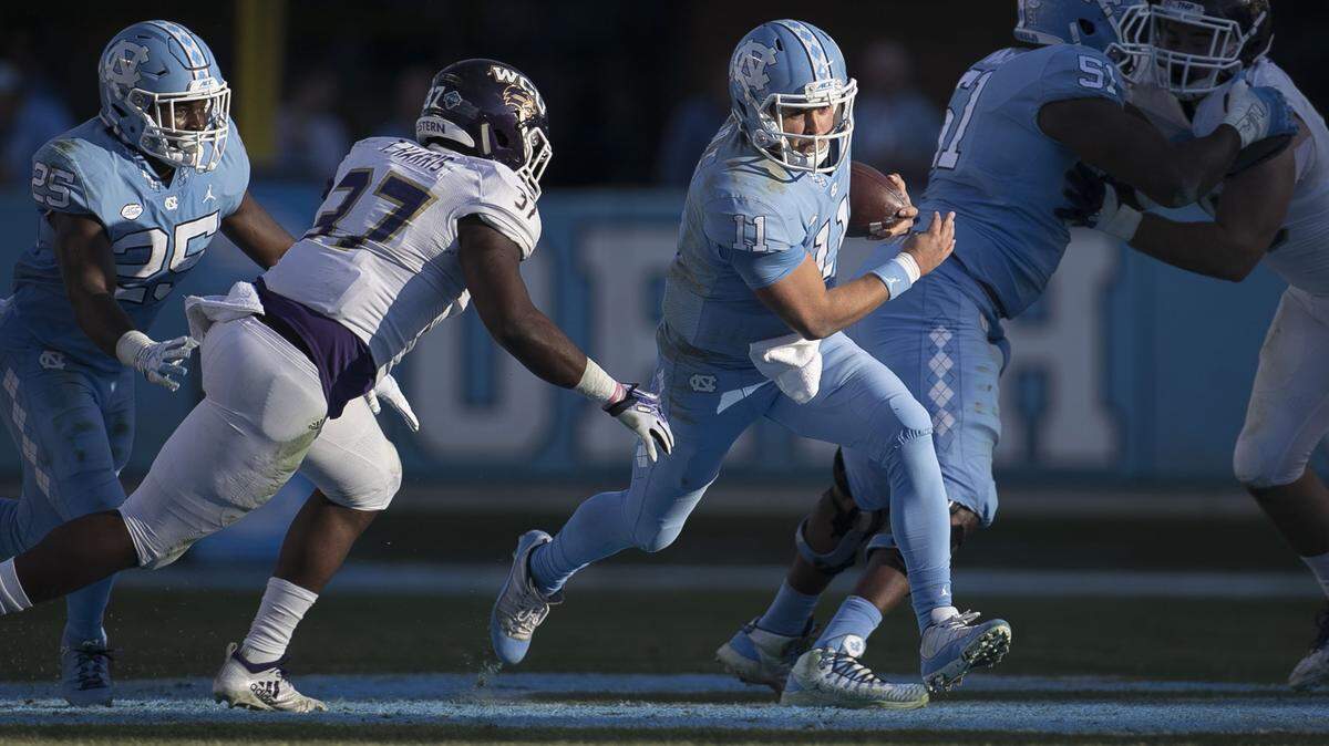 North Carolina quarterback Nathan Elliott (11)  picks up five yards in the first quarter against Western Carolina on Saturday, November 17, 2018 at Kenan Stadium in Chapel Hill.