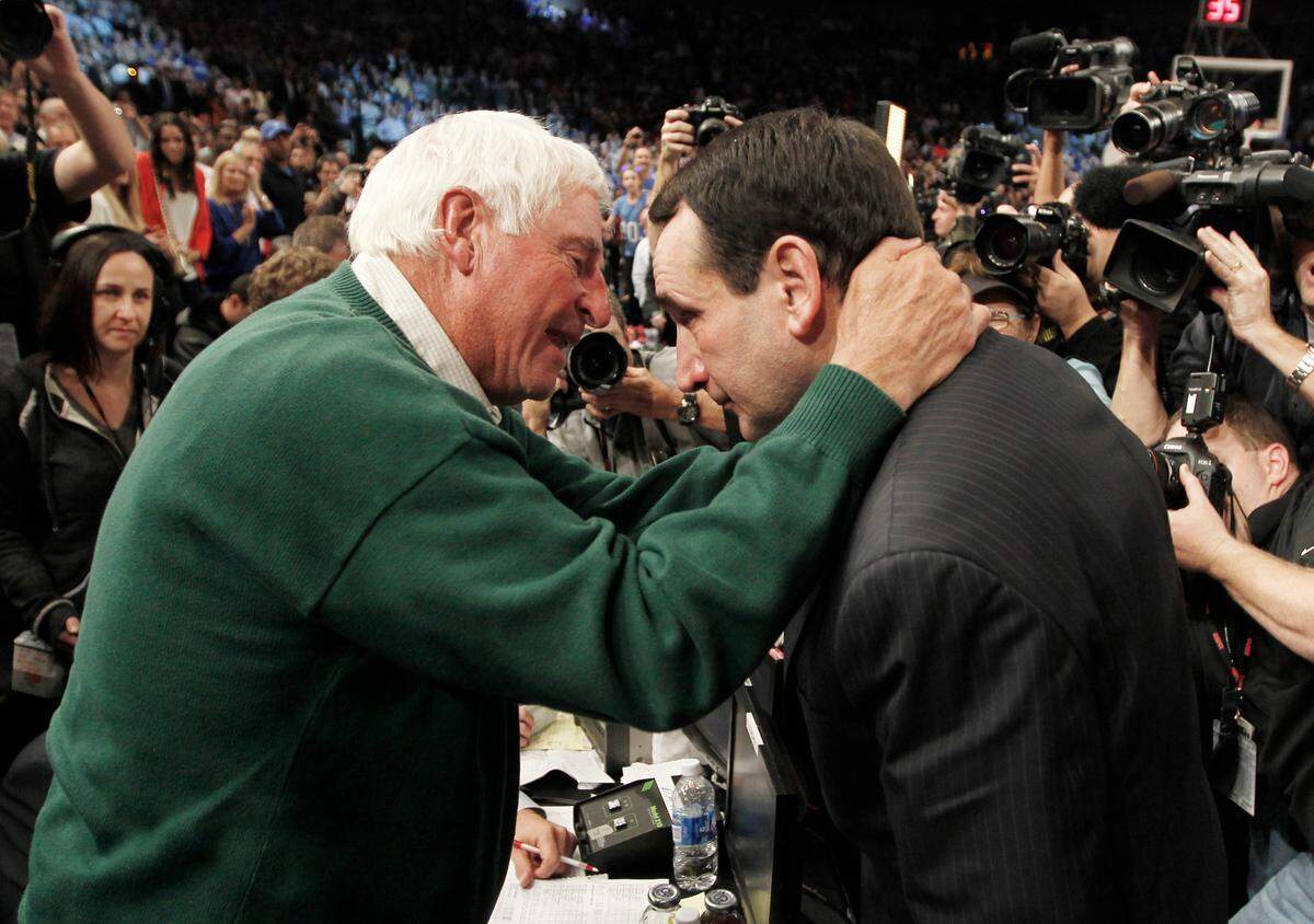 Duke head coach Mike Krzyzewski (right) speaks with mentor and former NCAA D1 record holder Bobby Knight as he wins number 903 to become the winningest coach of all time. Duke played Michigan State University at Madison Square Garden in New York City Tuesday Nov. 15, 2011.Duke played Michigan State University at Madison Square Garden in New York City Tuesday Nov. 15, 2011.