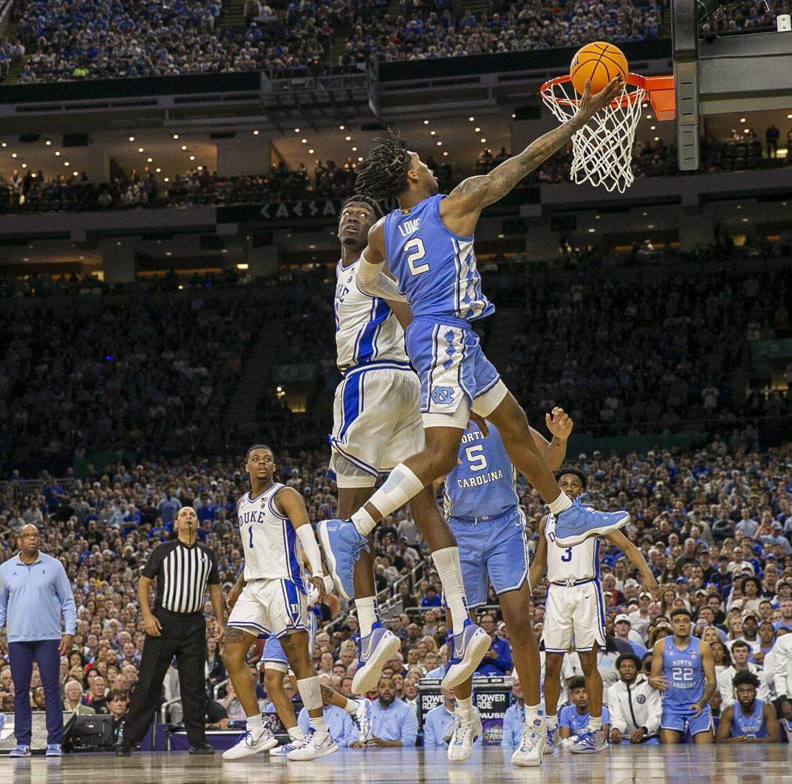 North Carolinas Caleb Love (2) drives to the basket past Dukes Mark Williams (15) for two of his game high 28 points, leading the Tar Heels to an 81-77 victory over Duke during the NCAA Final Four semi-final on Saturday, April 2, 2022 at Caesars Superdome in New Orleans, La.