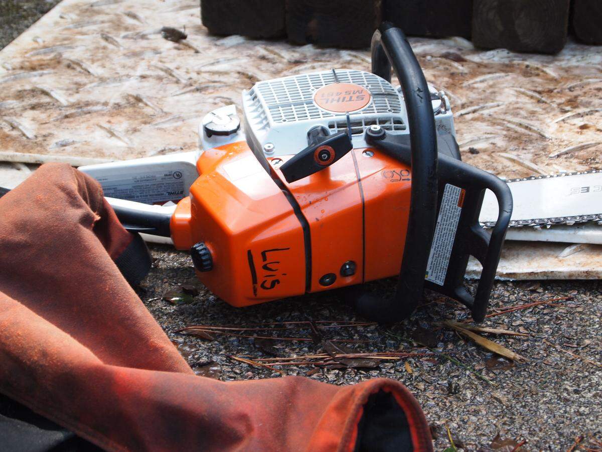 Francisco “Paco” Aldaz’s chainsaw, with his father Luis’ name on it, sits idle between Hurricane Florence cleanup jobs on Monday, Sept. 17, 2018.