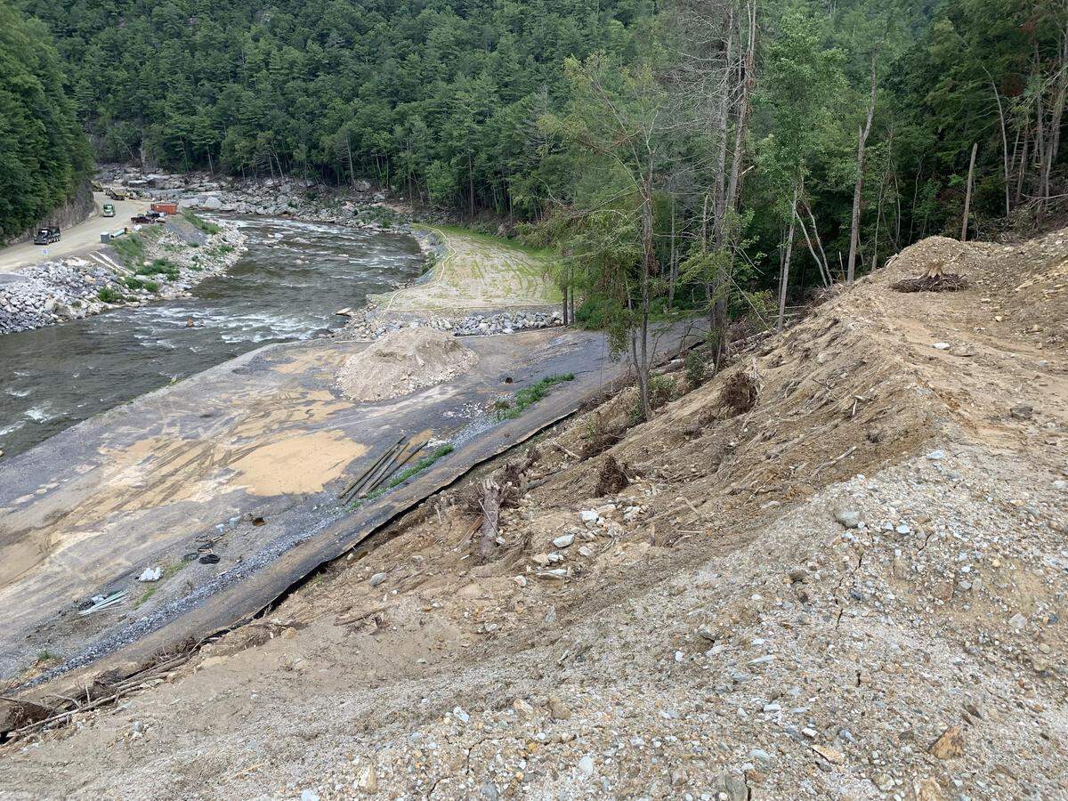 Runoff from an illegal open-pit mine dug by Horizon 30 LLC in the Mitchell County community of Poplar is dumping sediment into the Nolichucky River. Environmental groups are preparing to sue to try to force the company to stabilize the site.