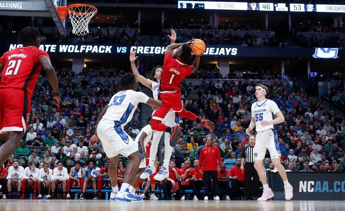 N.C. State’s Jarkel Joiner (1) heads to the basket as Creighton’s Ryan Nembhard (2) and Fredrick King (33) defend during Creighton’s 72-63 victory over N.C. State in the first round of the NCAA Tournament at Ball Arena in Denver, Colo., Friday, March 17, 2023.