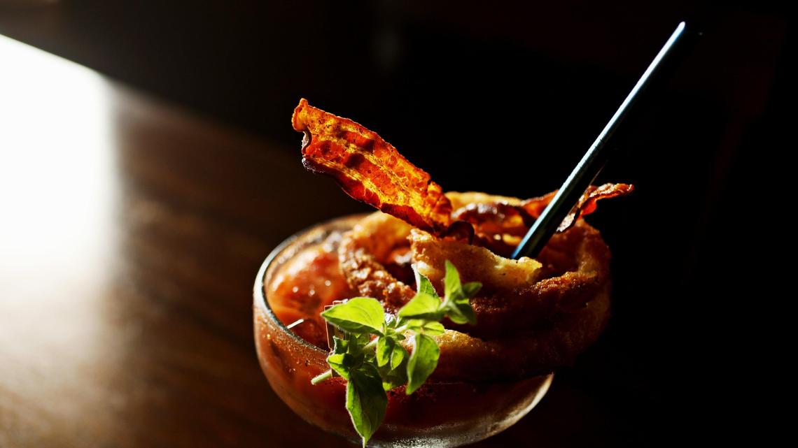 The Bloody Mary at Sophie’s Grill & Bar in Cary is topped with onion rings and bacon.