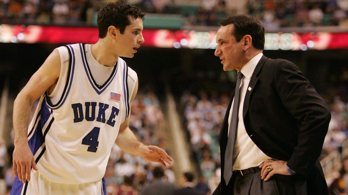 DUKE9.SP.031206.EDH -- Duke’s Mike Krzyzewski has words with J.J. Redick in the first half during Duke’s 78-76 victory over Boston College in the ACC Championship Sunday 3/12 in Greensboro. STAFF/ETHAN HYMAN
