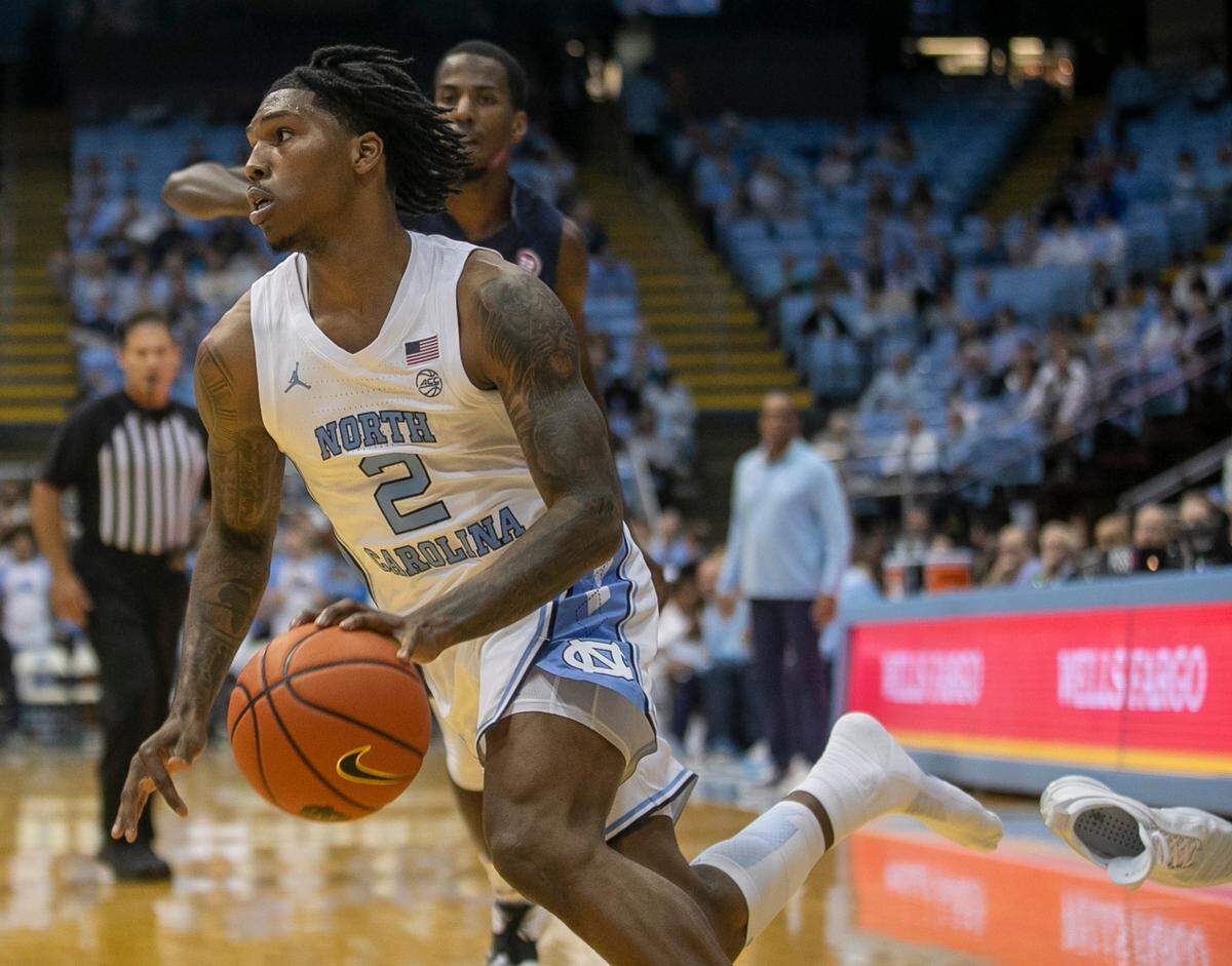 North Carolina’s Caleb Love (2) loses his shoe as he makes a move to the basket in the first half against Johnson C. Smith during an exhibition game on Friday, October 28, 2022 at the Smith Center in Chapel Hill, N.C.