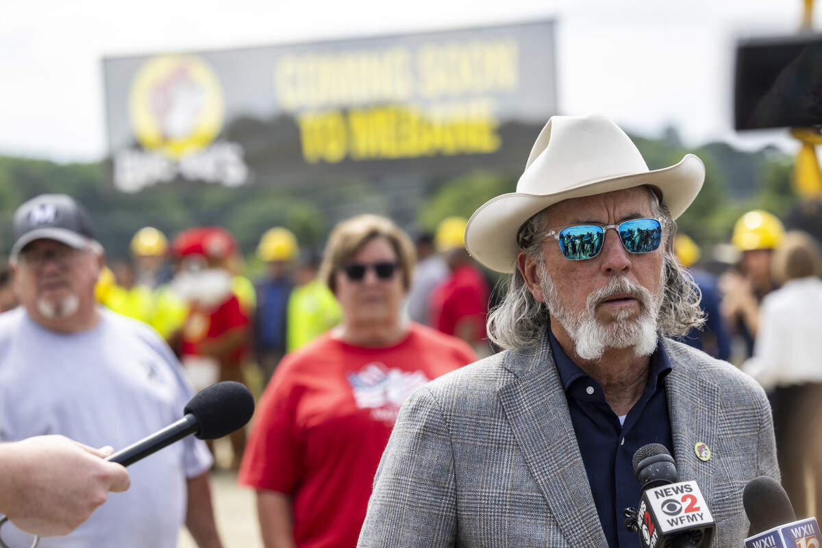 Buc-ee's co-founder Arch "Beaver" Aplin III answers questions from reporters following a groundbreaking ceremony for a Buc-ee's travel center on Wednesday, June 10, 2026, off Exit 152 on Interstates 85 and 40 in Mebane. The Texas-based company plans to build a 74,000-square-foot store that could open by the end of 2027, featuring 120 fuel pumps, 650 parking spaces and 24 electric vehicle charging stations.