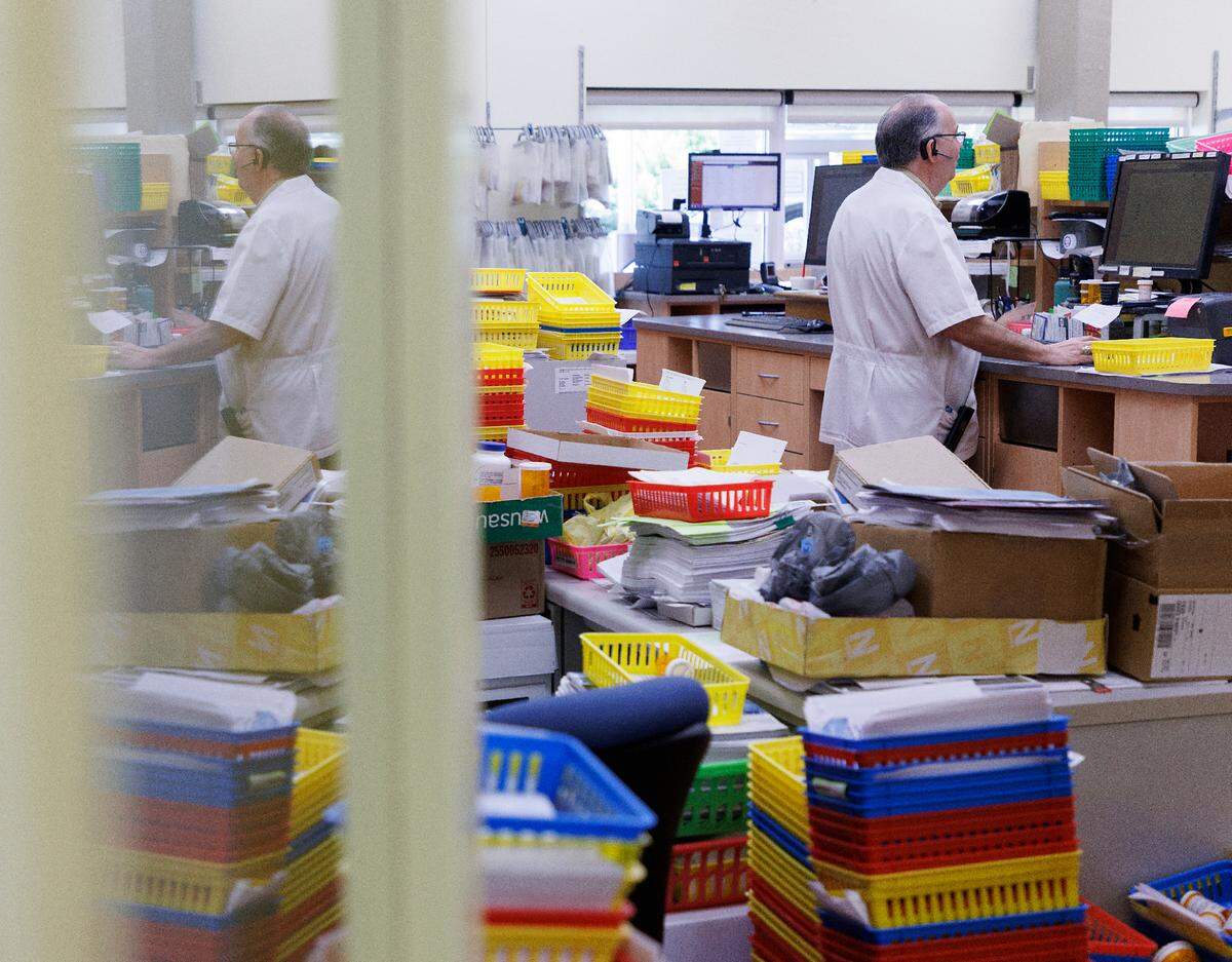 Pharmacist Keith Layne works at Layne’s Family Pharmacy on Wednesday, Aug. 14, 2024, in Eden, N.C.