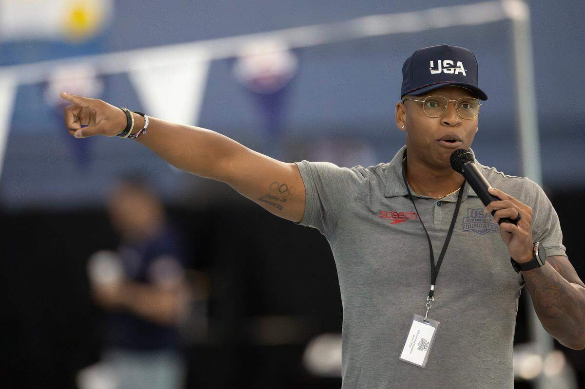 Olympic goal medalist Cullen Jones, an N.C. State graduate, addresses the crowd during a workout by the 2024 United States Olympic Swim Team on Saturday, July 6, 2024 at the Triangle Aquatic Center in Cary, N.C.