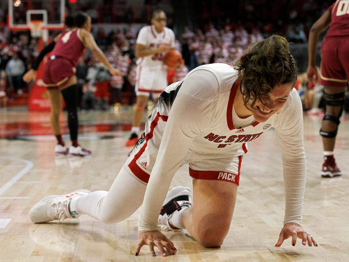 N.C. State’s River Baldwin grimaces after suffering an apparent injury during the second half of the Wolfpack’s 88-80 win over Florida State on Thursday, Jan. 4, 2023, at Reynolds Coliseum in Raleigh, N.C.