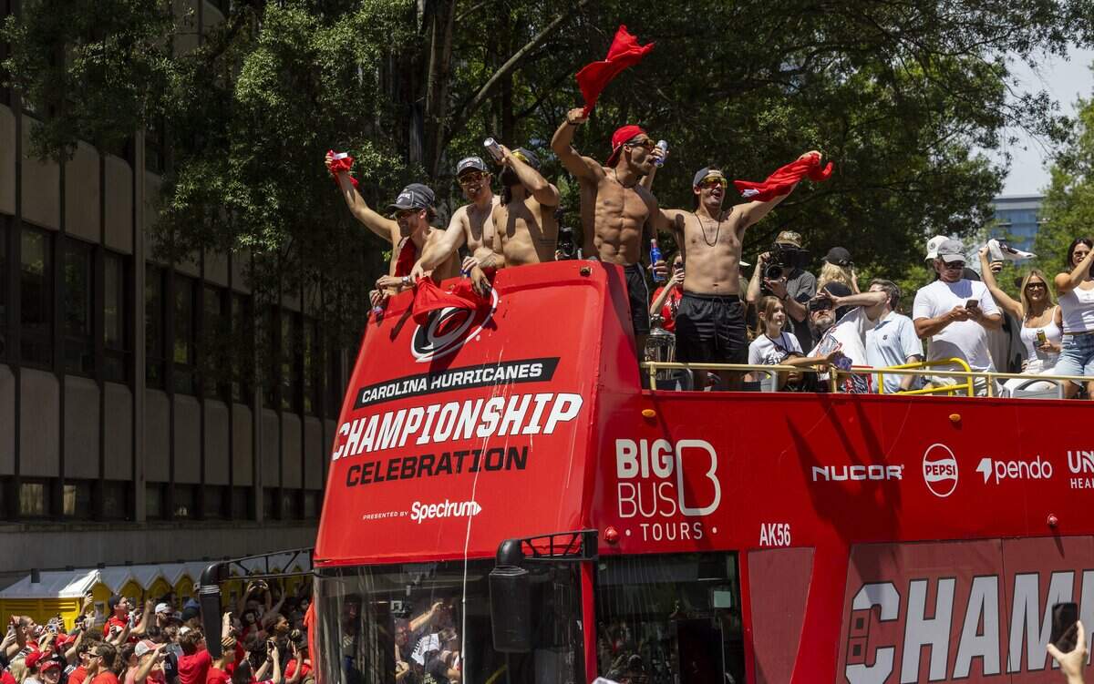 Thousands of Carolina Hurricanes fans gather in downtown Raleigh on Saturday, June 20, 2026, during a parade and rally celebrating the Hurricanes' Stanley Cup Final victory over the Vegas Golden Knights. The Hurricanes won the series 4-2 to capture the Stanley Cup for the second time since 2006.