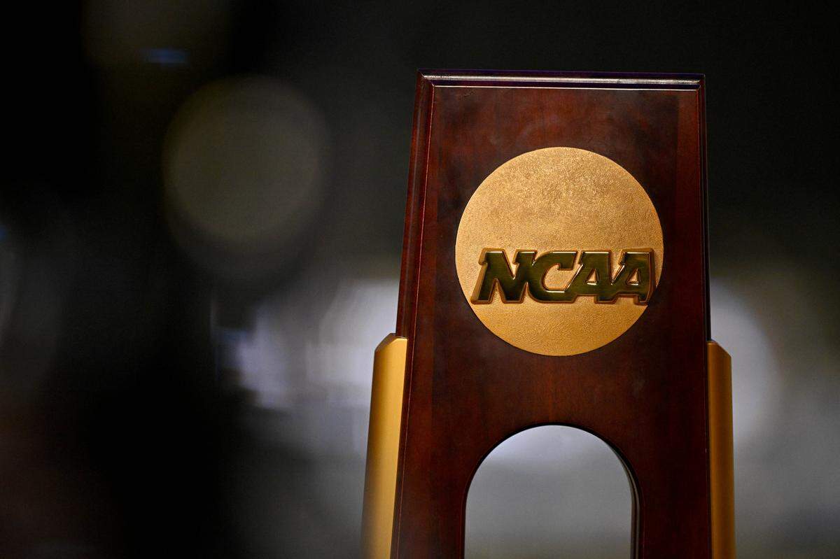 A view of the NCAA logo and trophy before the 2025 Women's National Gymnastics Championship at Dickies Arena. 