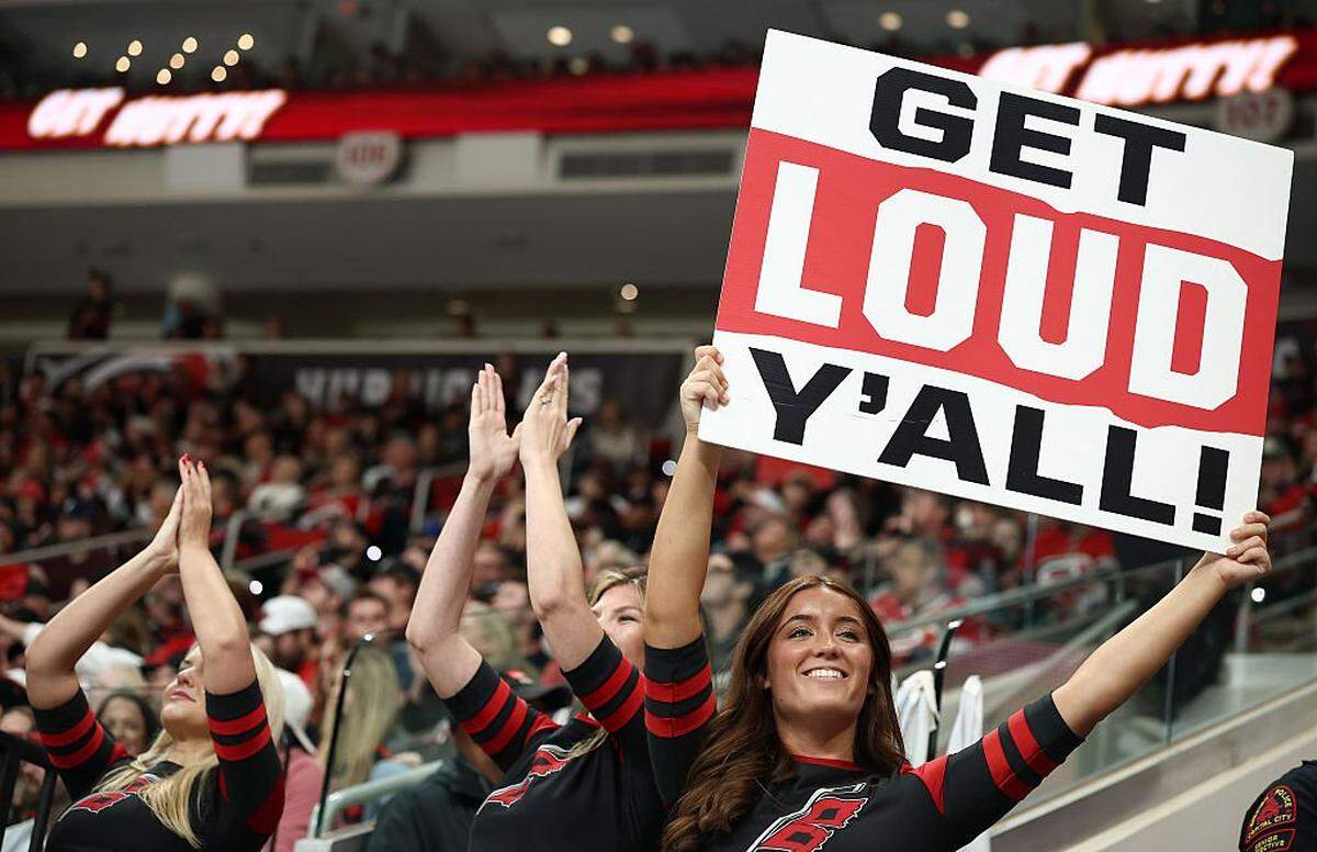 Carolina Hurricanes cheerleaders excite the crowd during the second period of the game between the Carolina Hurricanes and the New Jersey Devils at Lenovo Center on October 09, 2025 in Raleigh, North Carolina.