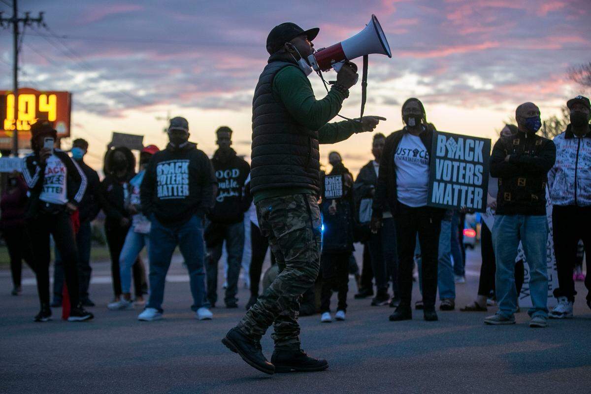 Tony Riddick addresses demonstrators at the intersection of Ehringhaus Street and Road Street during a march on Friday, April 23, 2021 in Elizabeth City, NC. This is the third day of protests following the shooting death of Andrew Brown Jr. at the hands of a Pasquotank Deputy on Wednesday.