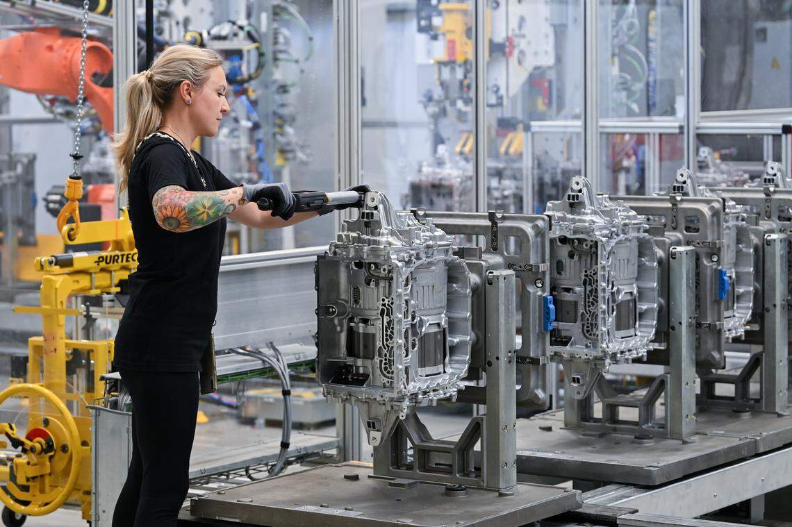 A worker assembles electric drive units for its CLA class electric vehicles at the Mercedes-Benz Untertuerkheim plant on June 30, 2025 in Stuttgart, Germany. 