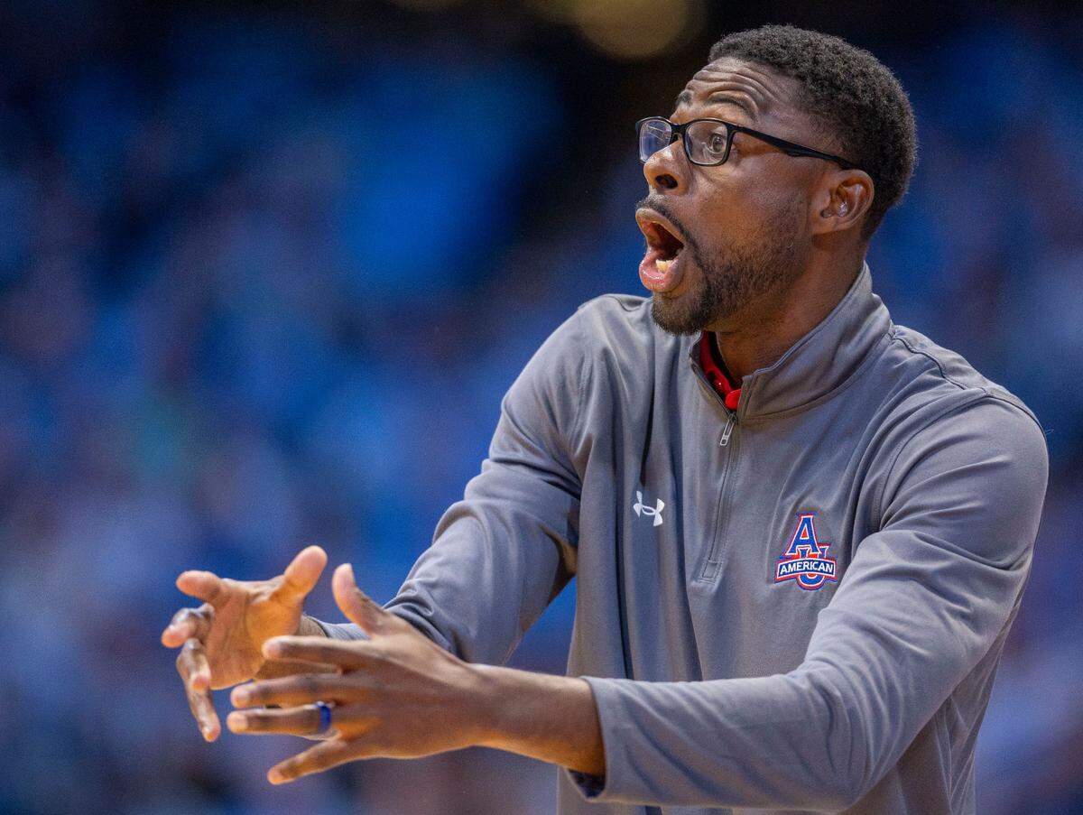 Former Tar Heel Jackie Manuel, now an assistant coach for American University, instructs his players during the first half against North Carolina on Friday, November 15, 2024 at the Smith Center in Chapel Hill, N.C.