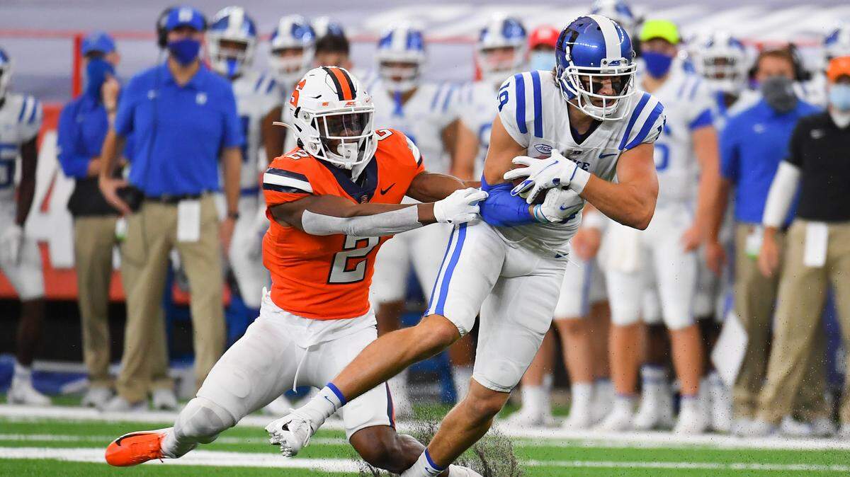 Duke Blue Devils wide receiver Jake Bobo (19) runs with the ball after a catch as Syracuse Orange defensive back Ifeatu Melifonwu (2) defends during the first quarter at the Carrier Dome.