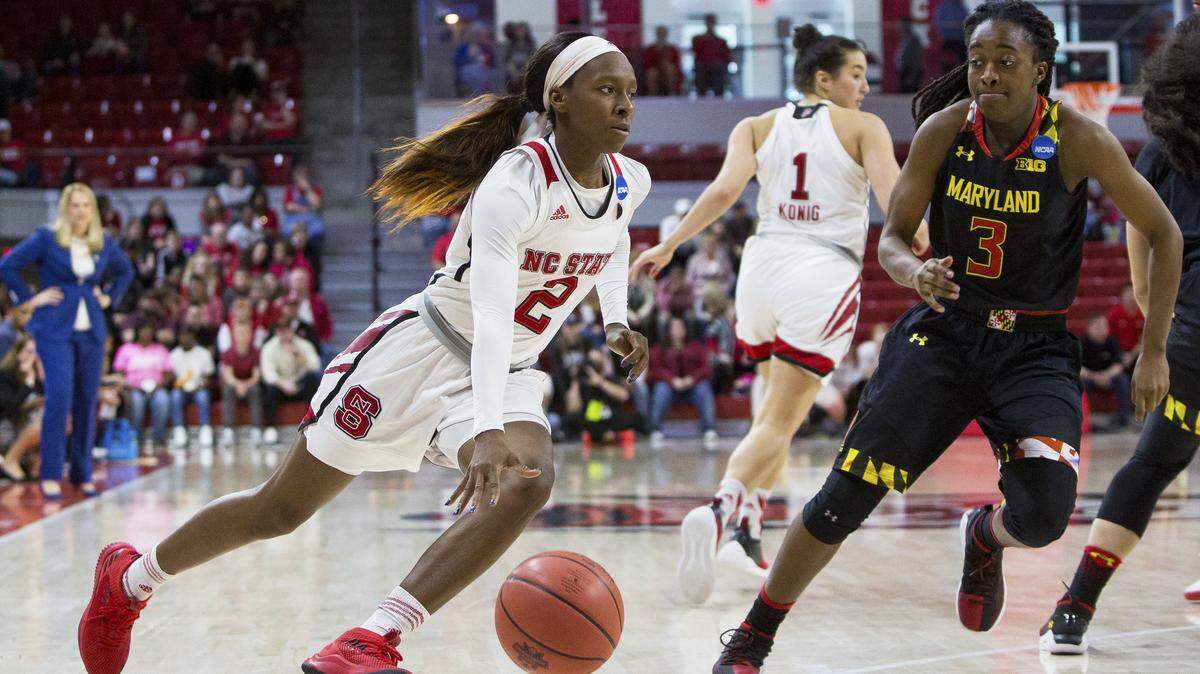 NC State's Kaila Ealey (2) drives around Maryland's Channise Lewis (3) during the second half of a second-round game in the NCAA women's college basketball tournament in Raleigh, N.C., Sunday, March 18, 2018. North Carolina State defeated Maryland 74-60.
