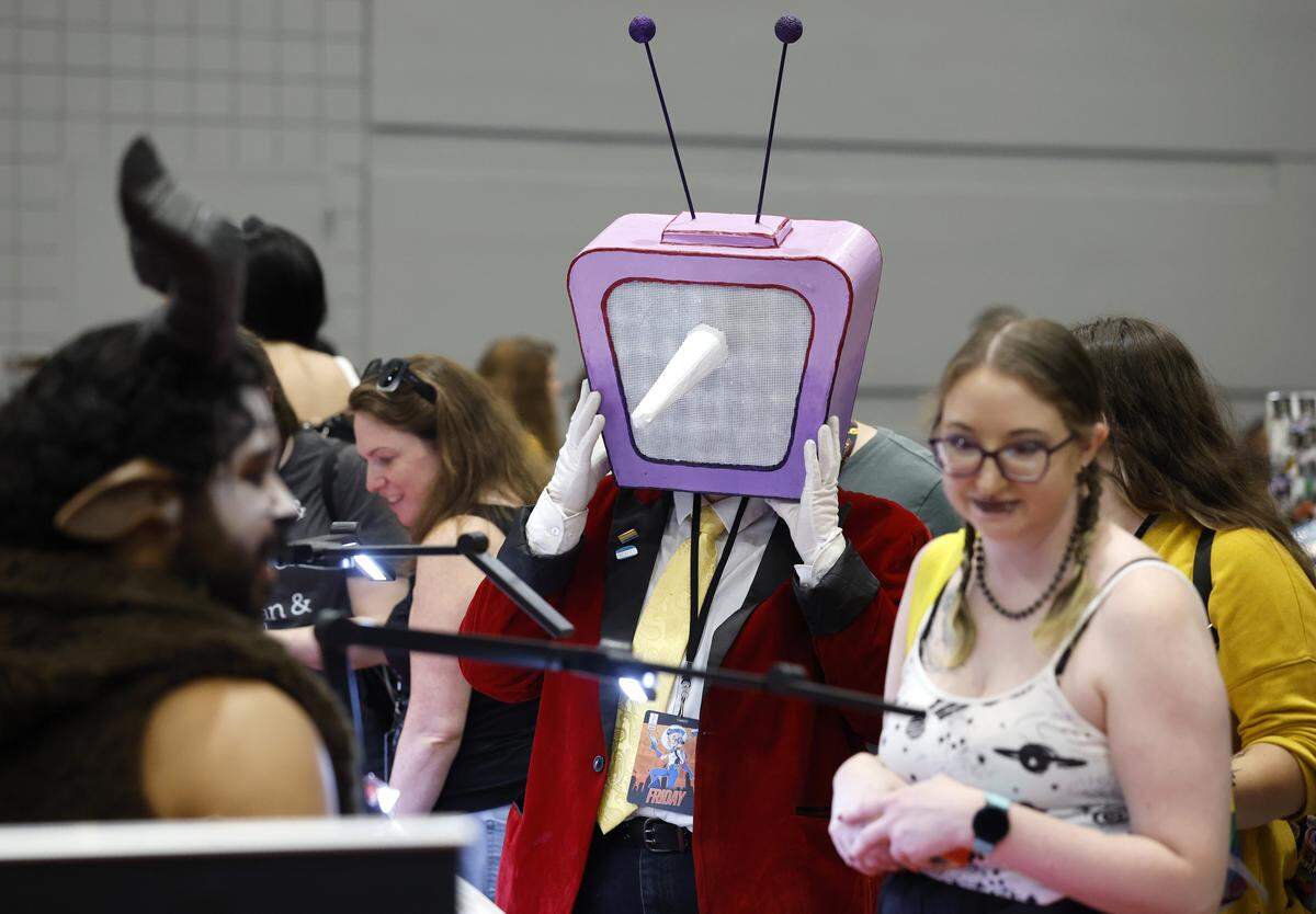 Andy Lewis from New Bern, cosplaying as Tenna from Deltarune, shops at GalaxyCon Raleigh at the Raleigh Convention Center Friday, July 25, 2025.