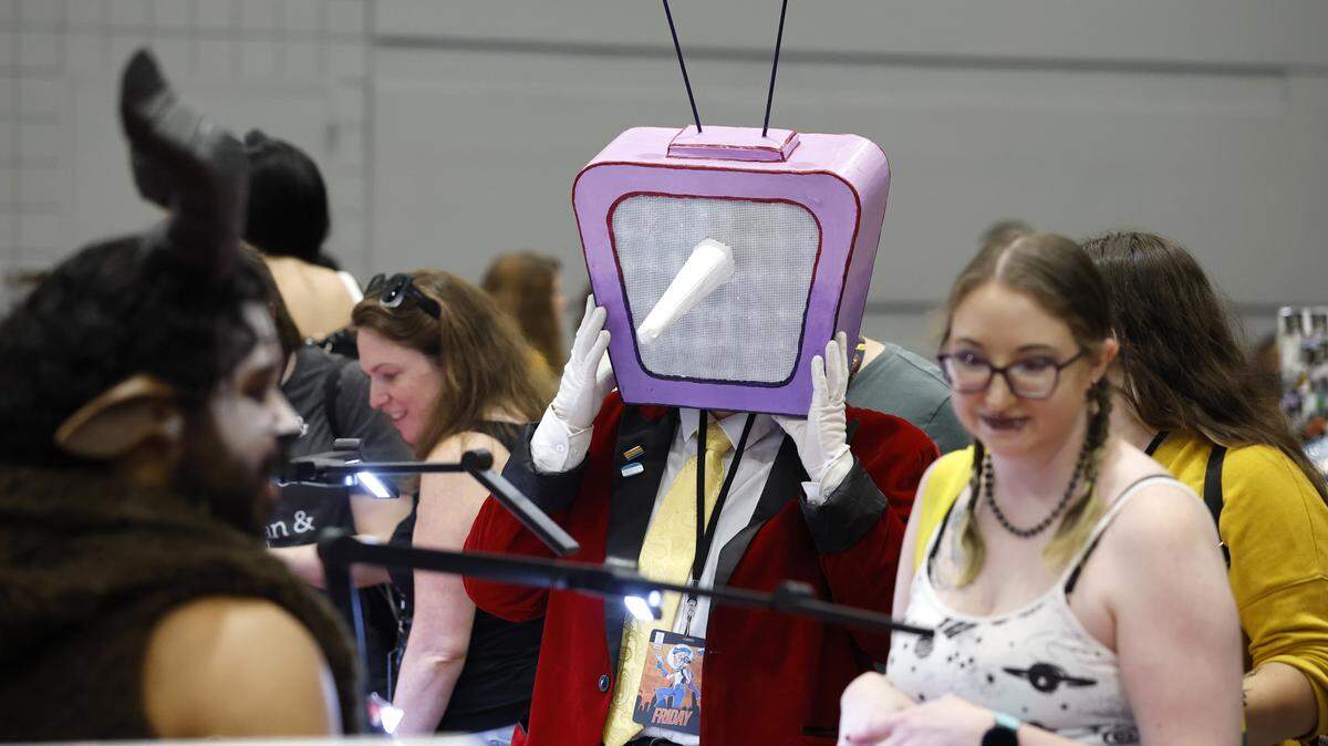 Andy Lewis from New Bern, cosplaying as Tenna from Deltarune, shops at GalaxyCon Raleigh at the Raleigh Convention Center in a file photo from July 2025. The convention center is adjusting schedules as a result of a fire on Dec. 2.