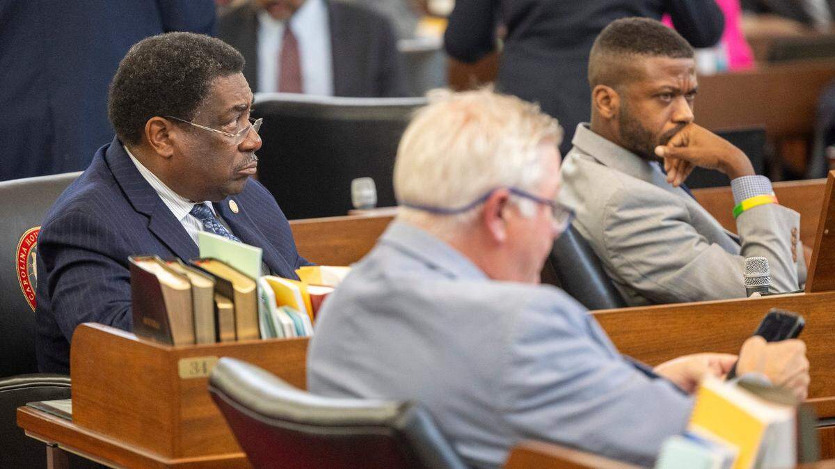 North Carolina state Reps. Garland Pierce, left, and Cecil Brockman, right, listen to debate as lawmakers prepare to hold the first of several votes on the budget at the General Assembly in Raleigh, N.C. on Sept. 21, 2023.
