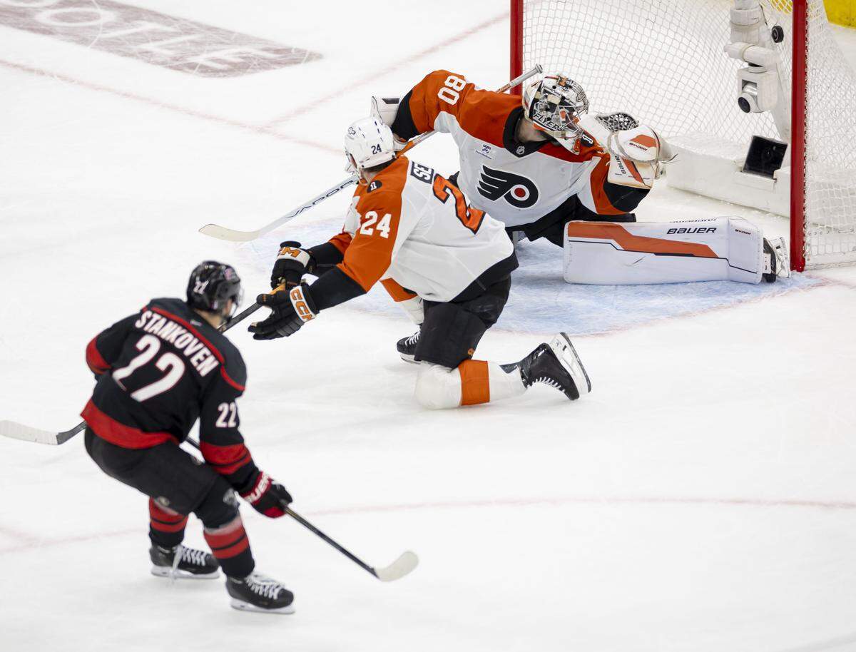 Carolina Hurricanes center Logan Stankoven (22) scores on Philadelphia goalie Dan Vladar (80) to take a 3-0 lead in the second period of Game 1 on Saturday, May 2, 2026, during the second round of the Stanley Cup Playoffs at Lenovo Center in Raleigh.