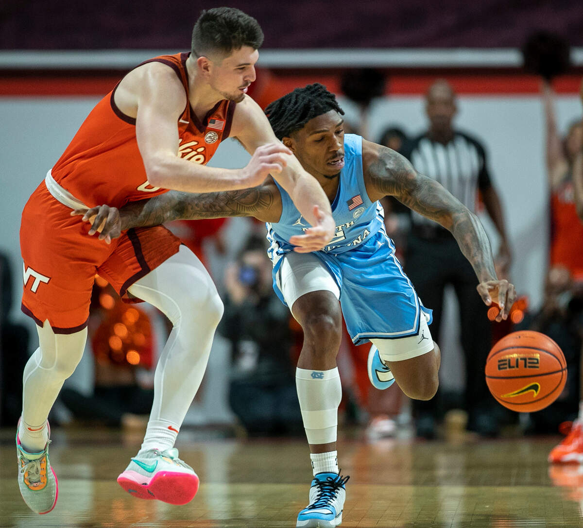 North Carolina’s Caleb Love (2) makes a steal from Virginia Tech’s Hunter Cattoor (0) during the first half on Sunday, December 4, 2022 at Cassell Coliseum in Blacksburg, Va.