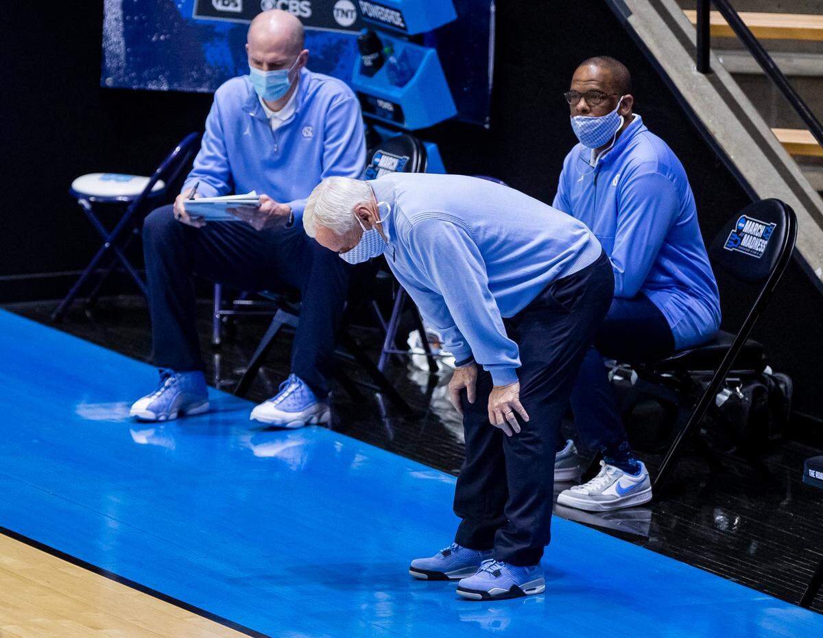 North Carolina head coach Roy Williams reacts after a turnover during the second half of a first-round game against Wisconsin in the NCAA men’s college basketball tournament, Friday, March 19, 2021, at Mackey Arena in West Lafayette, Ind. 