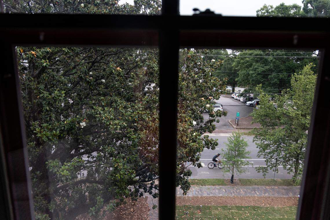 A cyclist rides along Blount Street, as seen from an upstairs window of the Andrews-Duncan House on Thursday, May 25, 2023, in Raleigh, N.C.