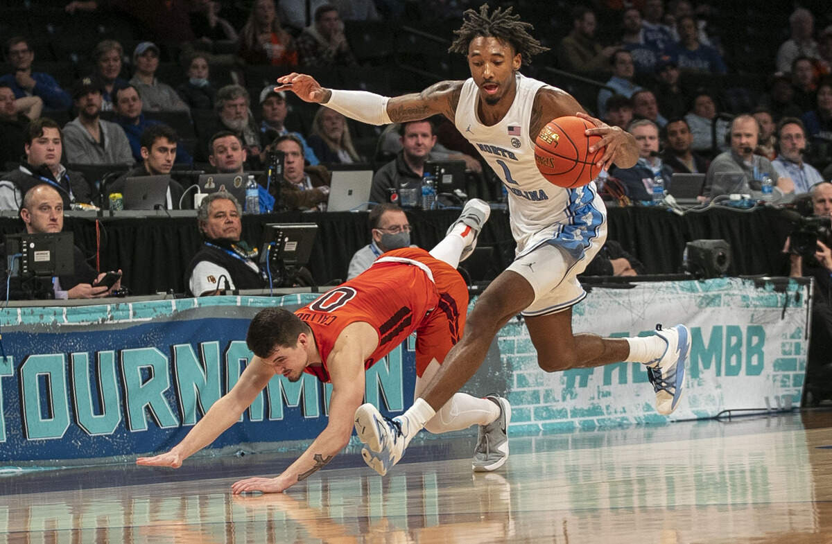 North Carolina’s Leaky Black (1) recovers the ball from Virginia Tech’s Hunter Cattoor (0) during the ACC Tournament semi-finals on Friday, March 11, 2022 in Brooklyn, N.Y.