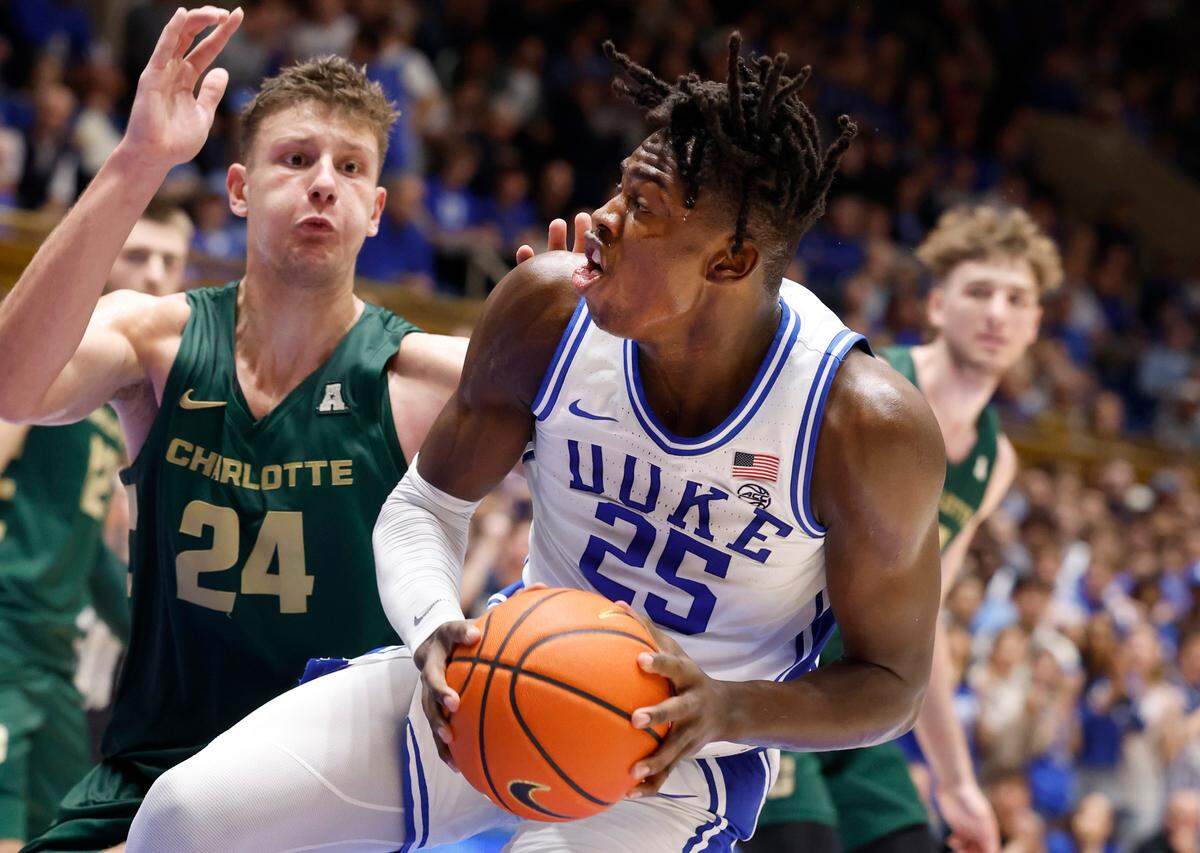 Duke’s Mark Mitchell (25) drives to the basket as Charlotte’s Igor Milicic Jr. (24) defends during the second half of Duke’s 80-56 victory over Charlotte at Cameron Indoor Stadium in Durham, N.C., Saturday, Dec. 9, 2023.