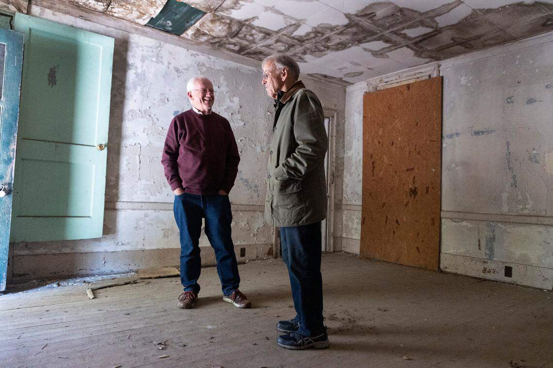 Myrick Howard, left, laughs with Richard Hunter as they look over the Thomas Reynolds house in Warrenton, N.C. on Monday, Nov. 13, 2023. The home, which dates to the early 19th century, is also known as Reynolds Tavern and is being offered for sale by Preservation North Carolina.