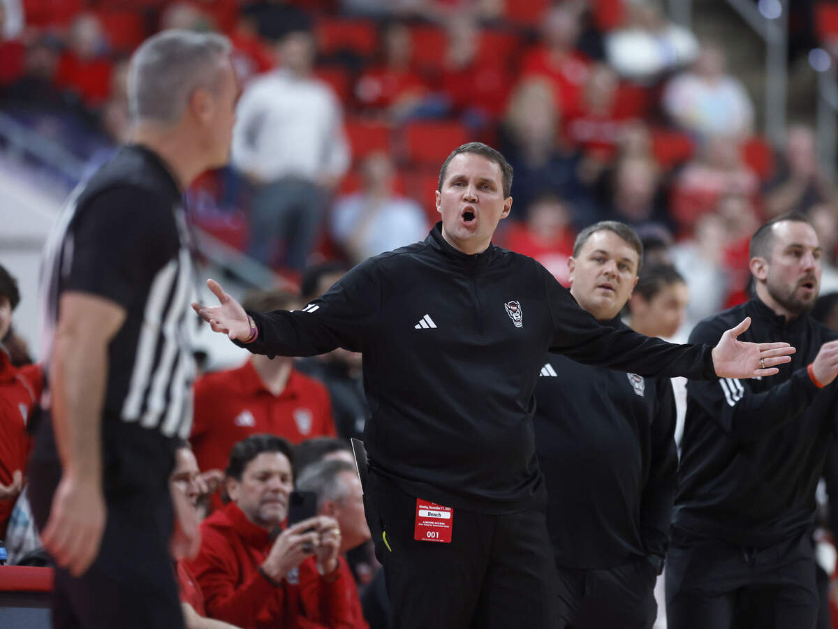 N.C. State head coach Will Wade speaks with an official during the first half of the Wolfpack’s game against VCU on Monday, Nov. 17, 2025, at the Lenovo Center in Raleigh, N.C.